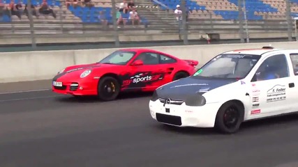 Porsche 997 Turbo S vs Opel Corsa Turbo