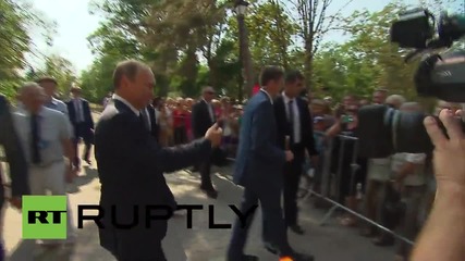 Russia: Putin places young girl on his shoulder as he greets Crimean crowds