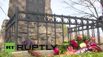 Czech Republic: Night Wolves lay flowers at Soviet War Memorial in Vitejovice