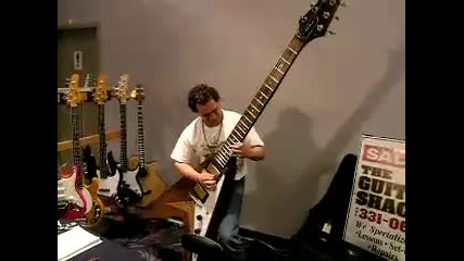 Dude rocks out on a monster sized Flying V guitar. 