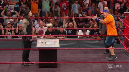Strong words are exchanged between John Cena and Roman Reigns