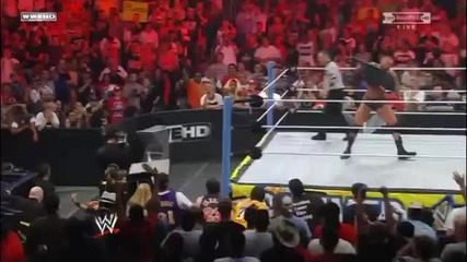 Randy Orton throws Christian off the apron through a table