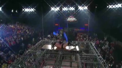 Jeff Hardy Splash On Cage Of Ladder Through Table