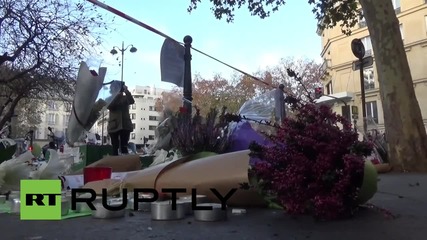 France: Mourners leave flowers in bullet holes at Paris attack sites