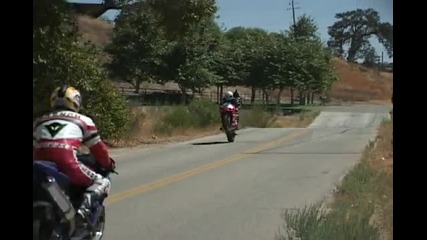 Gsxr1000 goes off jump and lands doing a wheelie