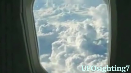 Ufo Sighting Disk Shaped Hovering in the Sky Next to an Airplane
