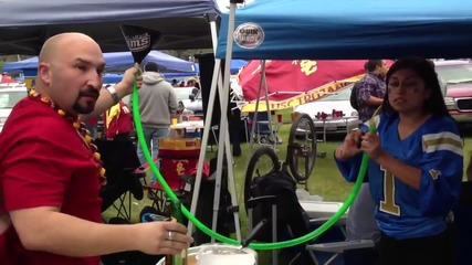 Beer bonging it while tailgating