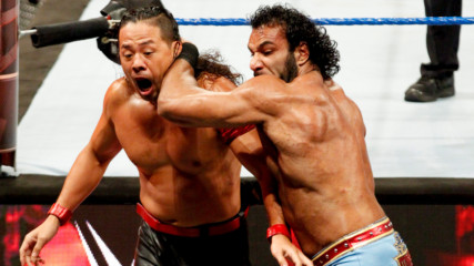 WWE Champion Jinder Mahal tosses Shinsuke Nakamura over the ringside barrier: WWE Hell in a Cell 2017 (WWE Network Exclusive)