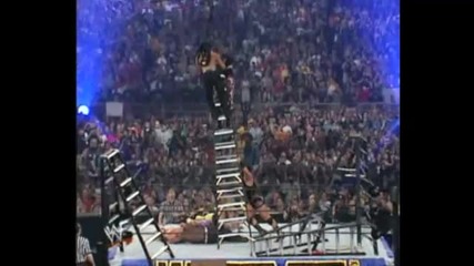 Rhino throws Matt Hardy & Bubba Ray off the Ladder through four Tables