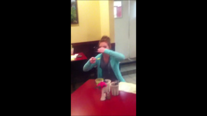 Hot redhead girl eats a spoonful of wasabi almost pukes