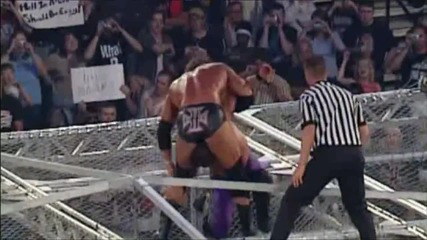 Triple H Pedigrees Chris Jericho at the top of Hell in a Cell