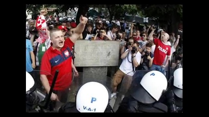 Polish and Russian soccer fans clash outside the National Stadium in Warsaw