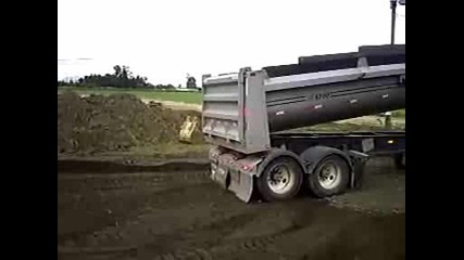 Dumping with the quad axle end dump