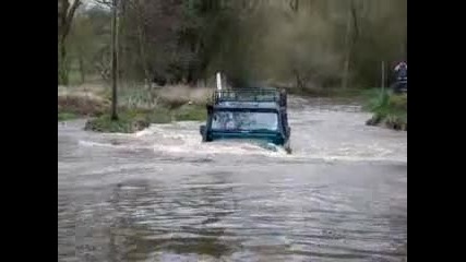 land rover defender 90 nearly swept away in ford