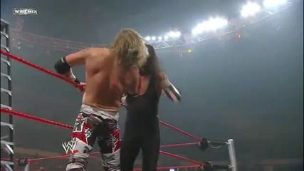 Undertaker Chokeslams Edge from the Apron through a Ladder