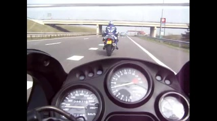 Honda Cbr 600f riding along with a Suzuki Gsx - R 600 97 