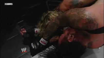Edge Spears The Undertaker through the Announcer Table