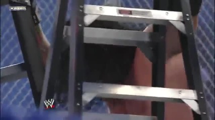 Undertaker Chokeslams Edge through the ring