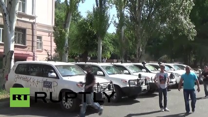 Ukraine: OSCE cars covered in graffiti at Donetsk protest