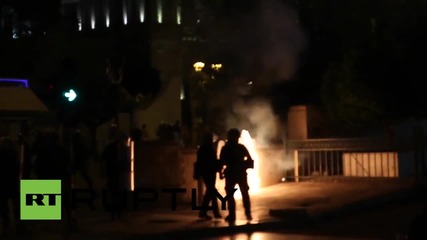 Greece: Protesters throw Molotov cocktails at riot police in front of parliament