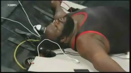 Big Show chokeslams Mark Henry through the announcer table