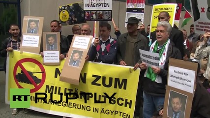 Germany: Protesters demand Germany release Al Jazeera reporter Ahmed Mansour
