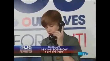 Justin Bieber on the Phone at Bet Sos Help For Haiti