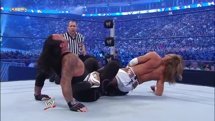 Shawn Michaels uses a modified Figure Four to weaken The Undertaker
