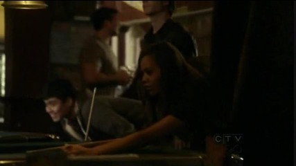 Damon watches through the window while Elena calls Stefan