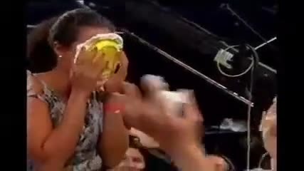 Girl in audience accept take pie in the face.