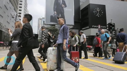 China Restricts Travel of Locals to Hong Kong to Cool Tensions