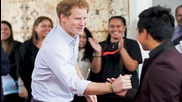 Prince Harry Jokes Around and Puts a Purple Handprint on a Photographer's Head