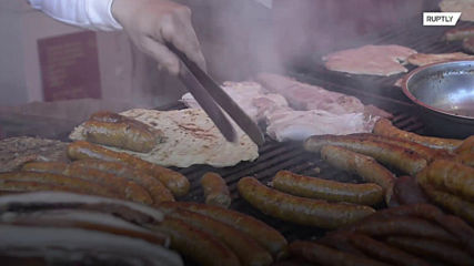 Serbian’s chomp on world’s longest sausage coil