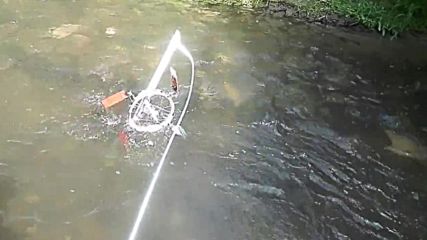 How to boost power of an river water wheel using gravity force for articulating paddles