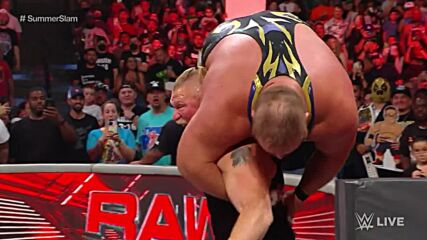 Brock Lesnar F-5s Otis through the announce table