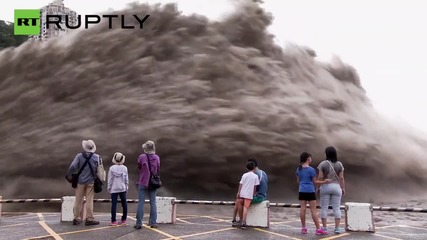 Crowds Watch Jets of Flood Water Shooting Out of Shihmen Dam