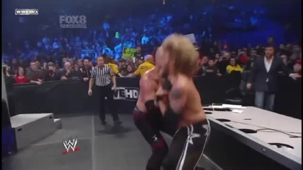 Kane Chokeslams Edge through the Announcer Table