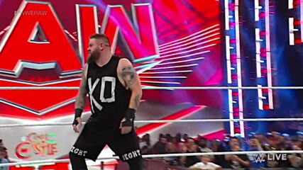 Kevin Owens powerbombs Chad Gable onto Otis