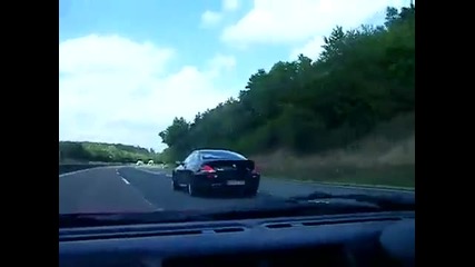 Bmw M6 playing with a Ferrari 355 spider. 