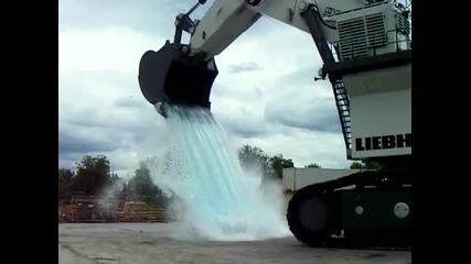 Excavator Liebherr with waterfall on a car 