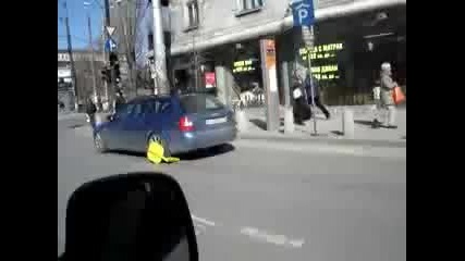 Man Drive Car With Clamp On Wheel