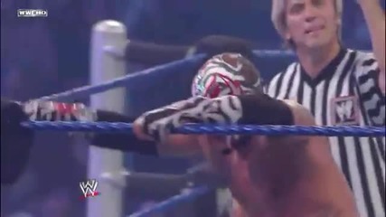 Rey Mysterio - Diving Seated Senton to outside ring