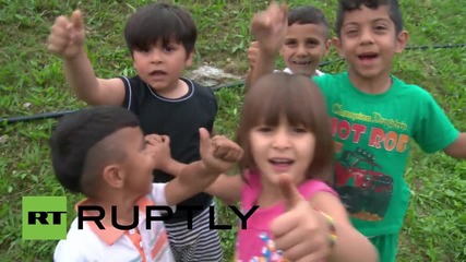 Croatia: Refugees gather in village on Slovenian border