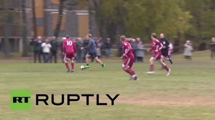 Latvia: MPs and refugees go head-to-head in football friendly