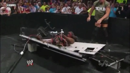 Big Show Chokeslams Mark Henry through the Announcer Table