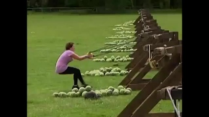woman takes watermellon to face from giant slingshot 