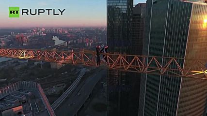 Crane-Climbing Daredevils Dangle Miles Above Moscow