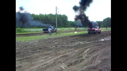 Diesel trucks racing in the mud