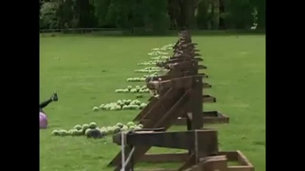 woman takes watermellon to face from giant slingshot 