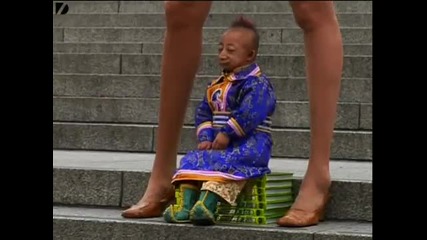 Smallest Man Meets Tallest Legs 